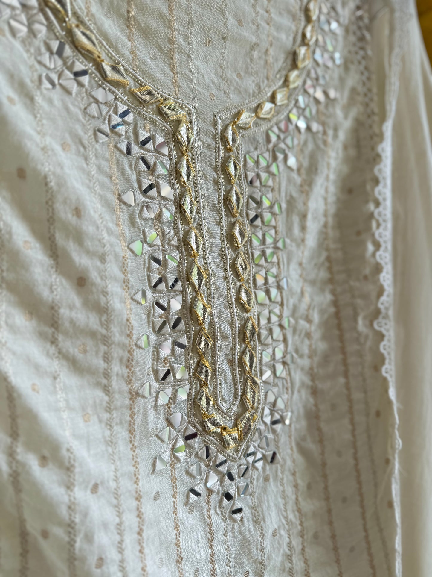 Luxurious Mul chanderi gold appliqué work suit