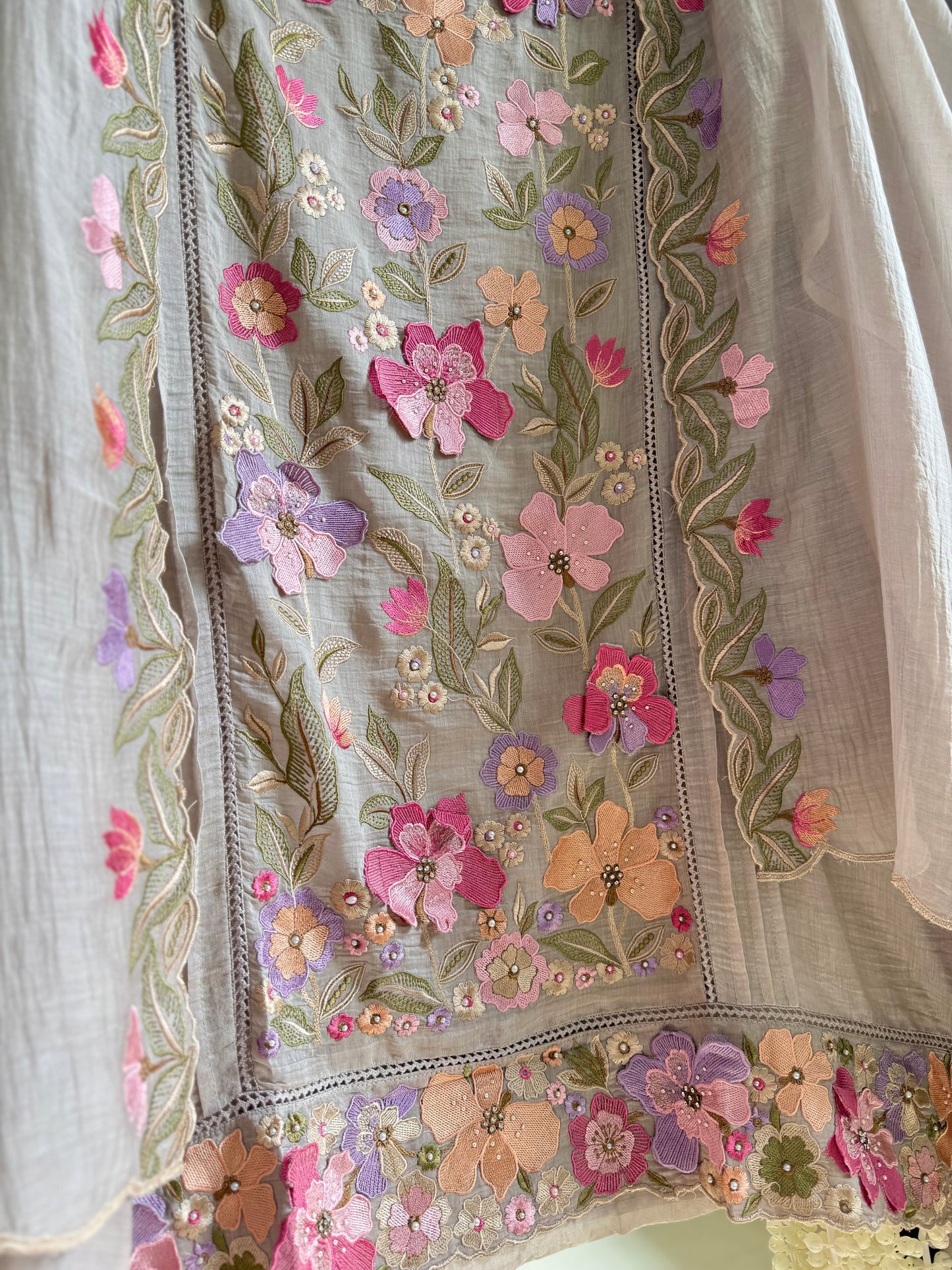 Luxurious Mul chanderi appliqué work floral suit