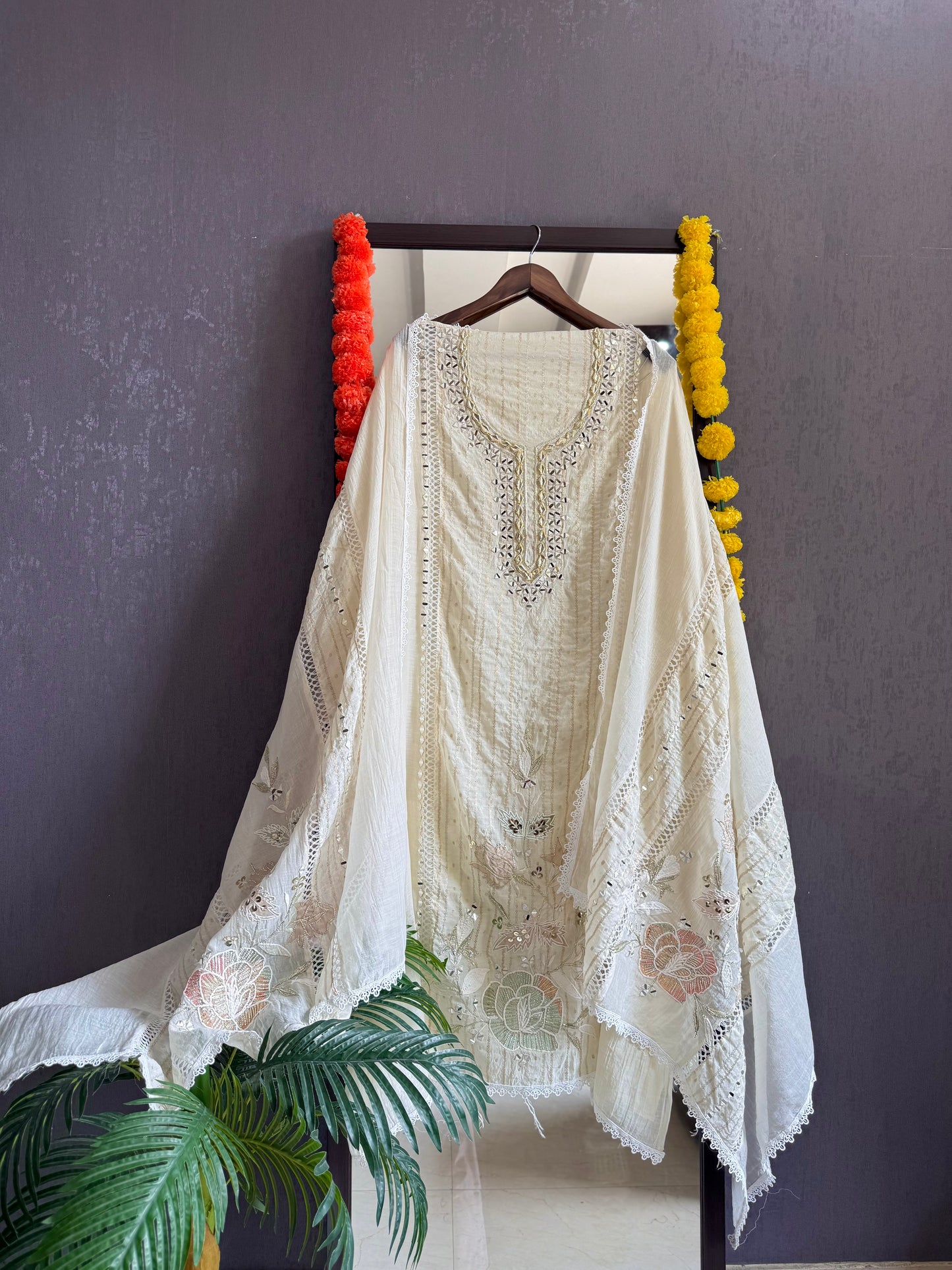 Luxurious Mul chanderi gold appliqué work suit