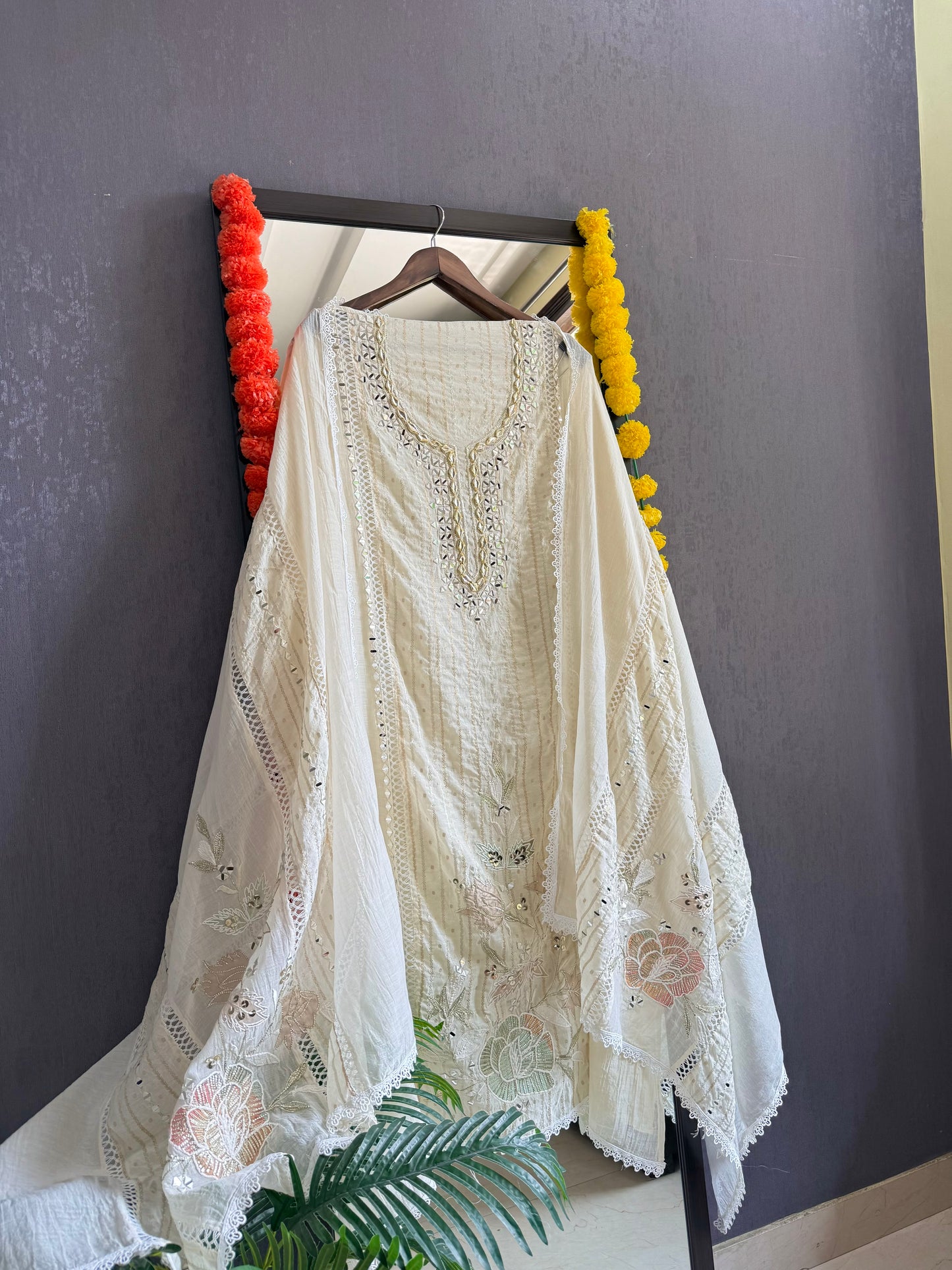 Luxurious Mul chanderi gold appliqué work suit