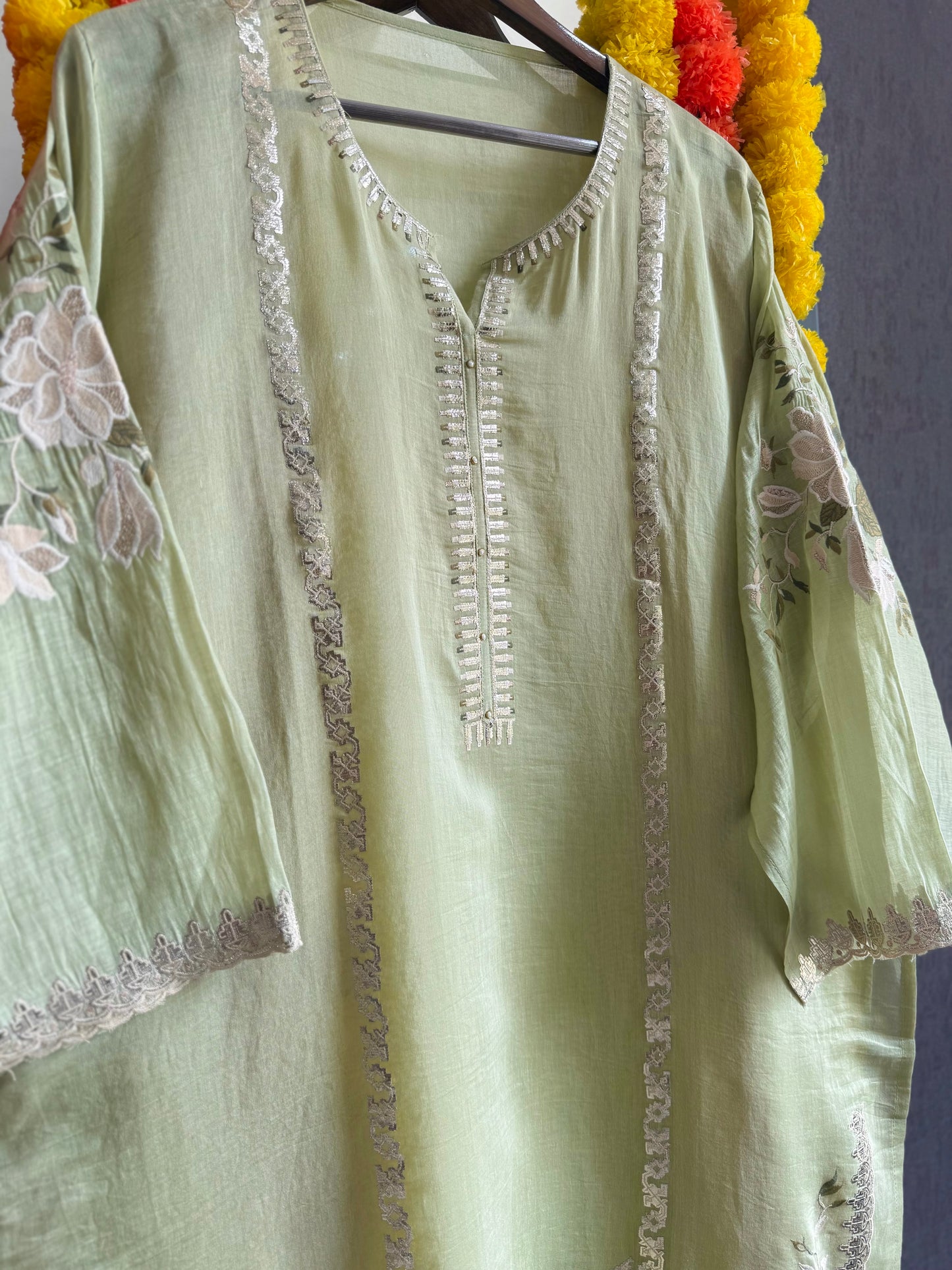 Luxurious Mul chanderi gold appliqué work suit
