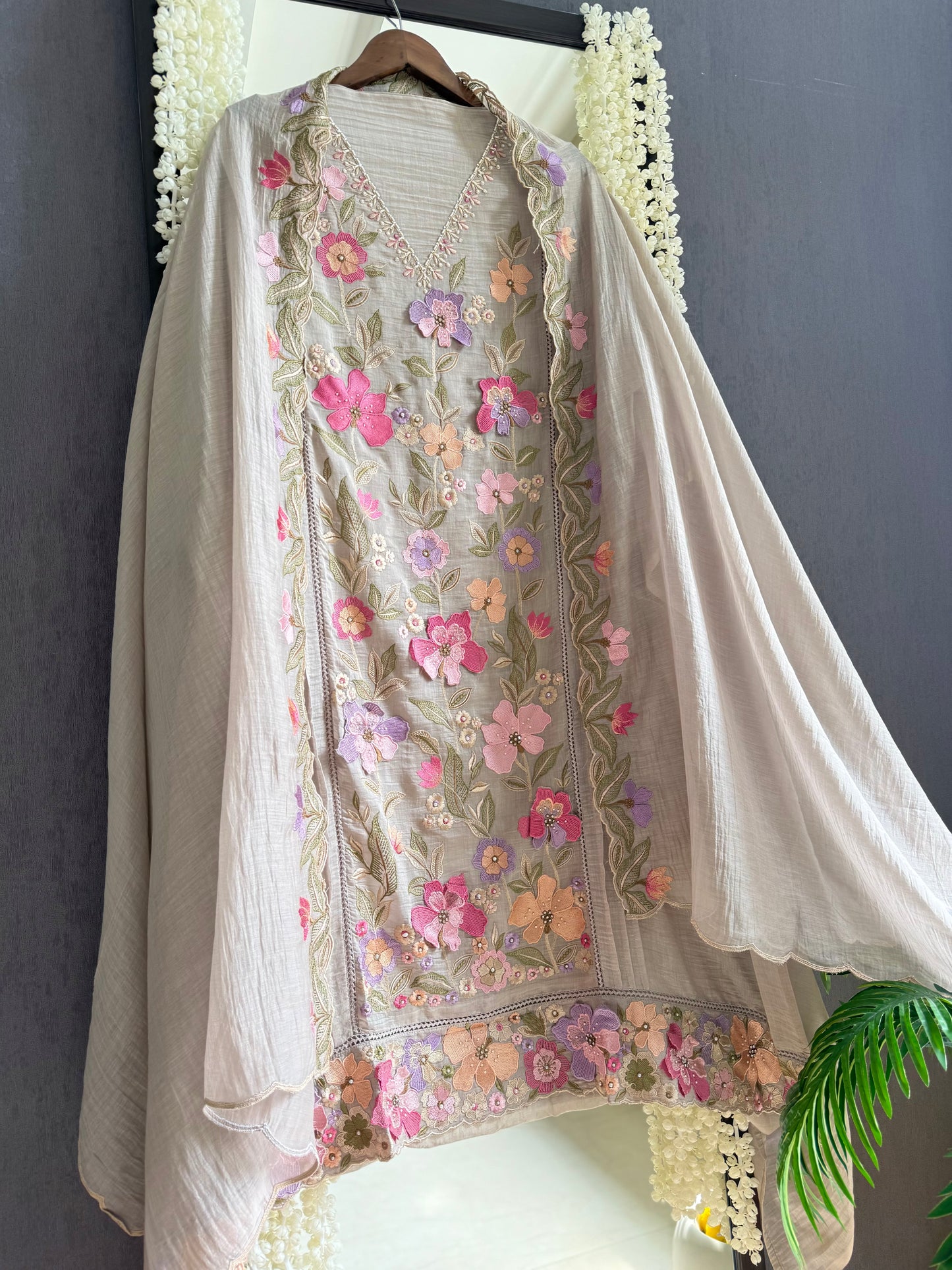 Luxurious Mul chanderi appliqué work floral suit