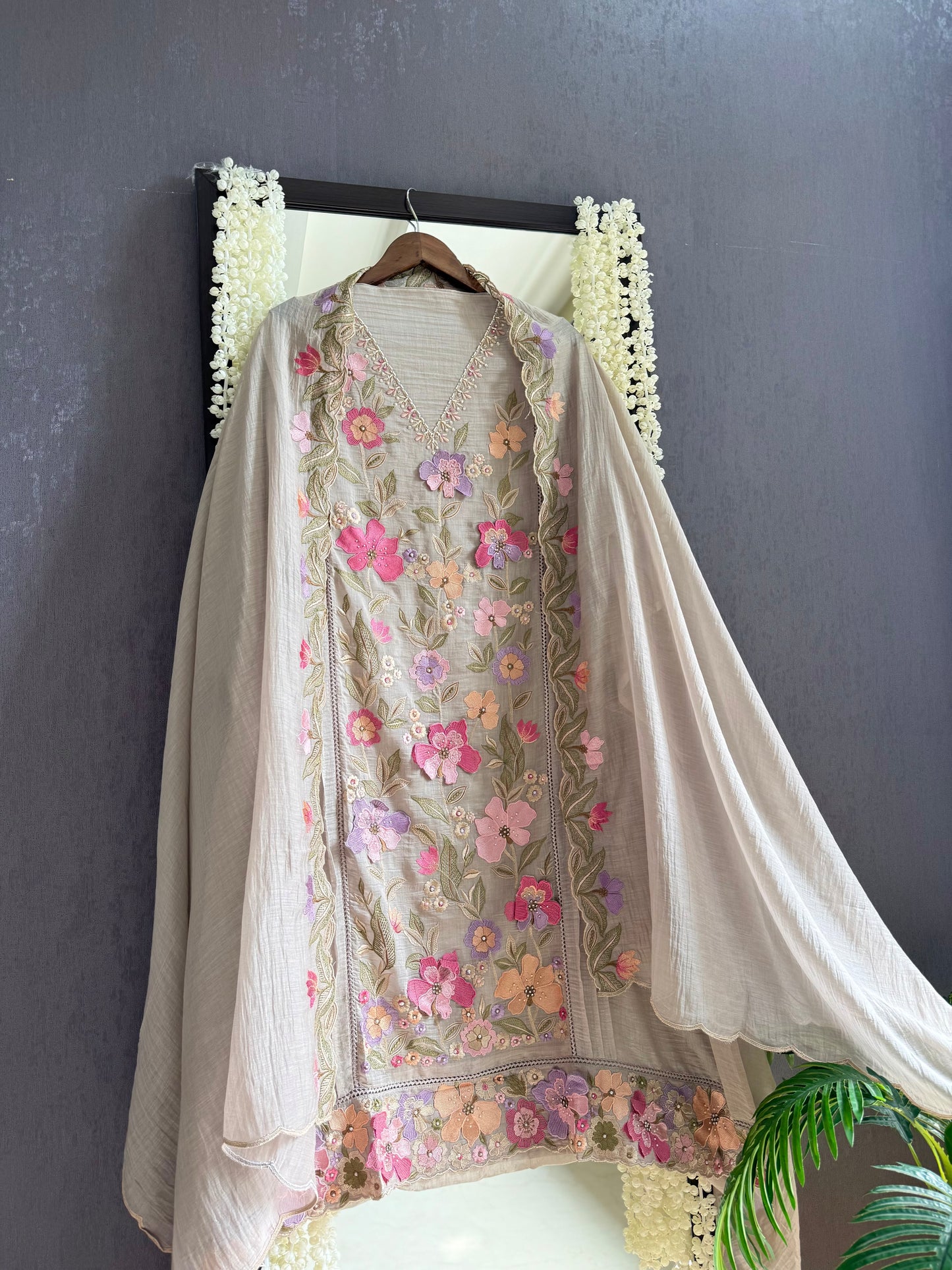 Luxurious Mul chanderi appliqué work floral suit