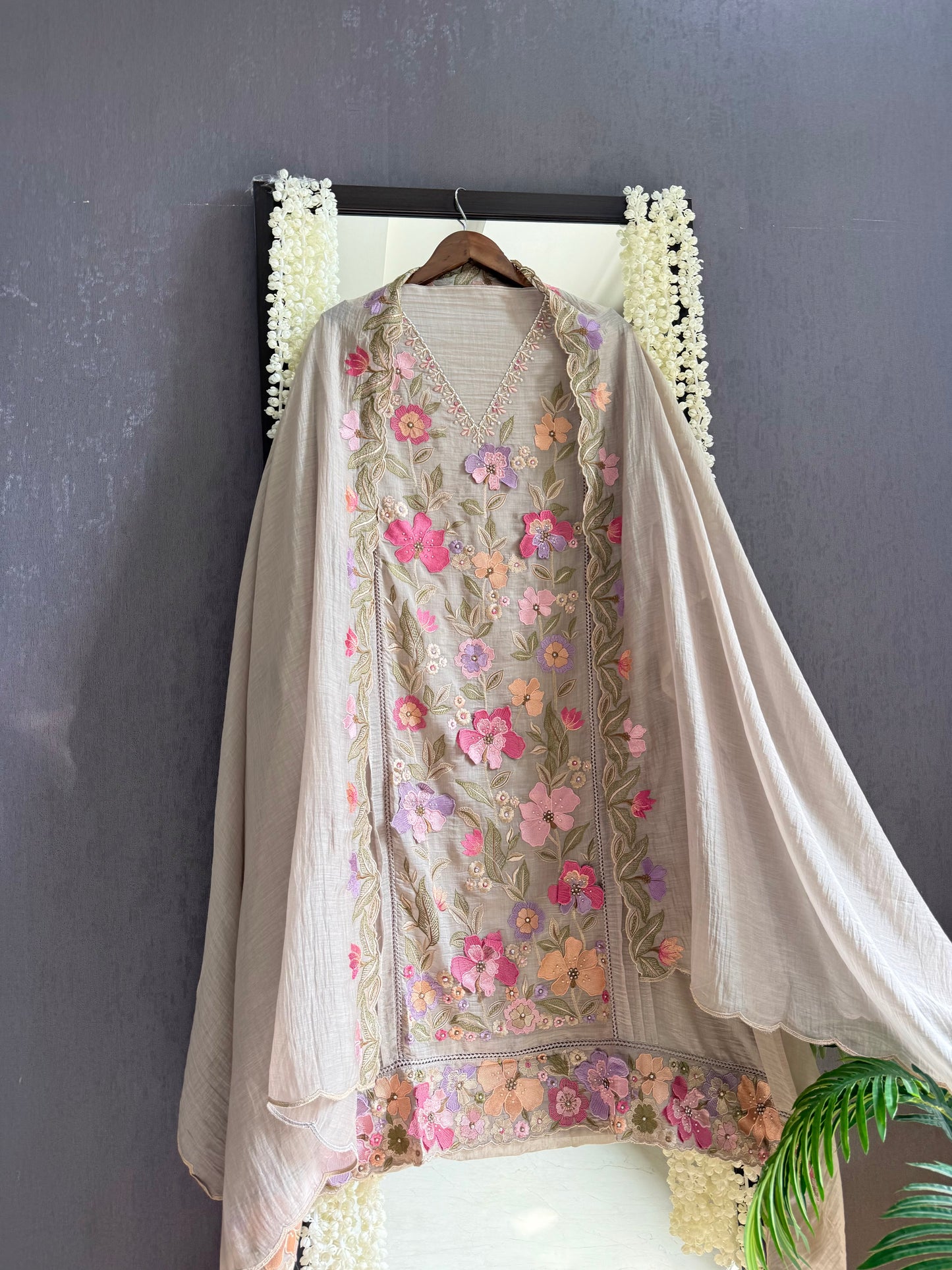 Luxurious Mul chanderi appliqué work floral suit