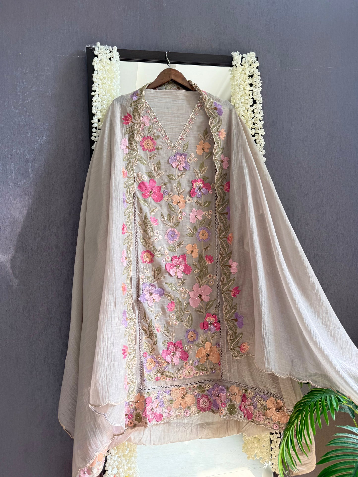 Luxurious Mul chanderi appliqué work floral suit