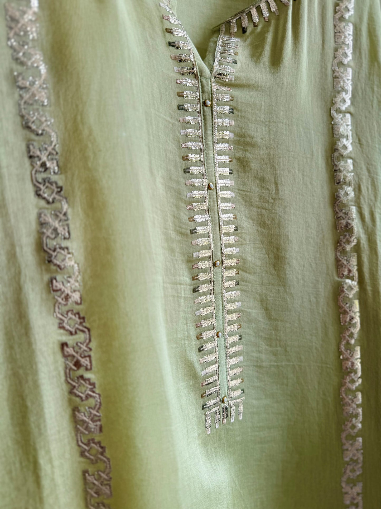 Luxurious Mul chanderi gold appliqué work suit
