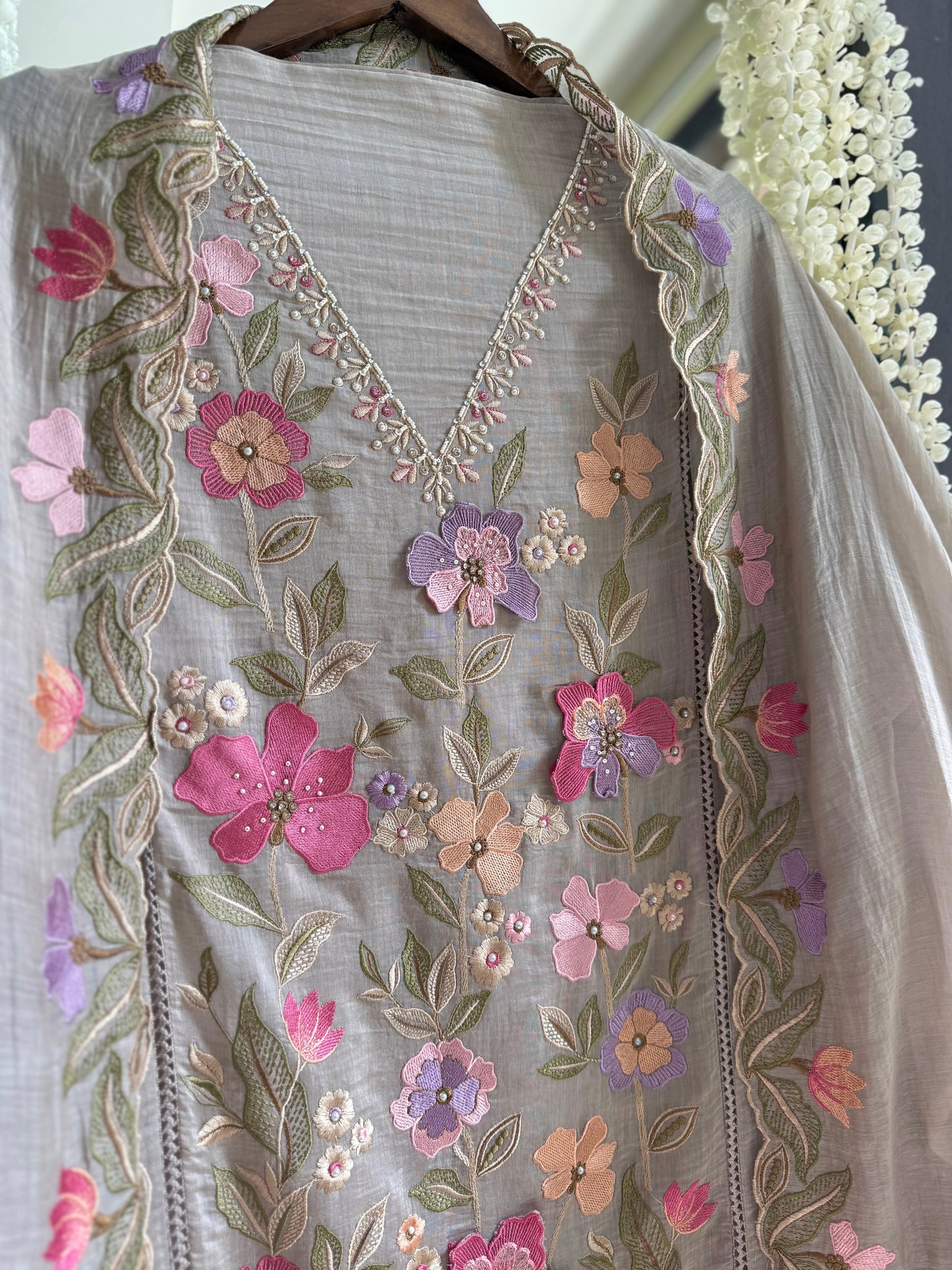 Luxurious Mul chanderi appliqué work floral suit