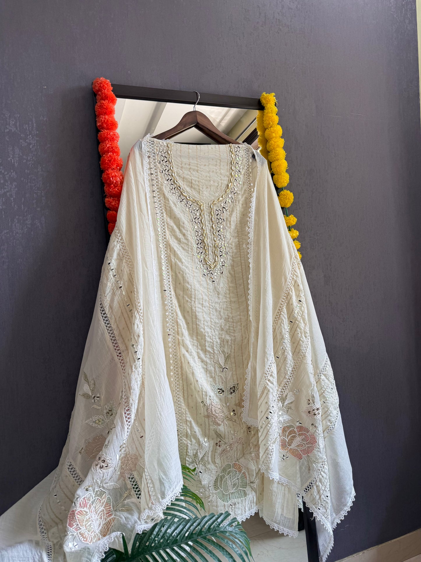 Luxurious Mul chanderi gold appliqué work suit