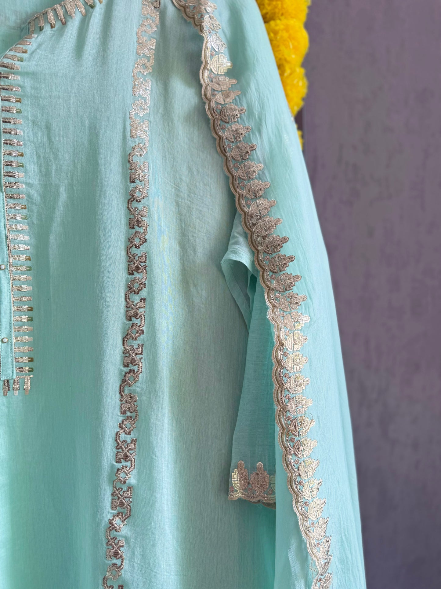 Luxurious Mul chanderi gold appliqué work suit
