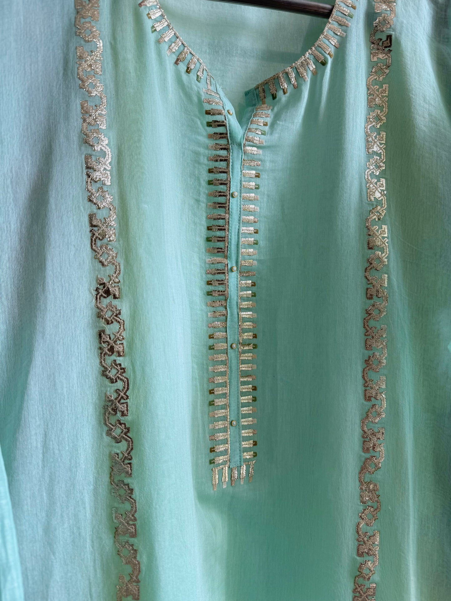 Luxurious Mul chanderi gold appliqué work suit
