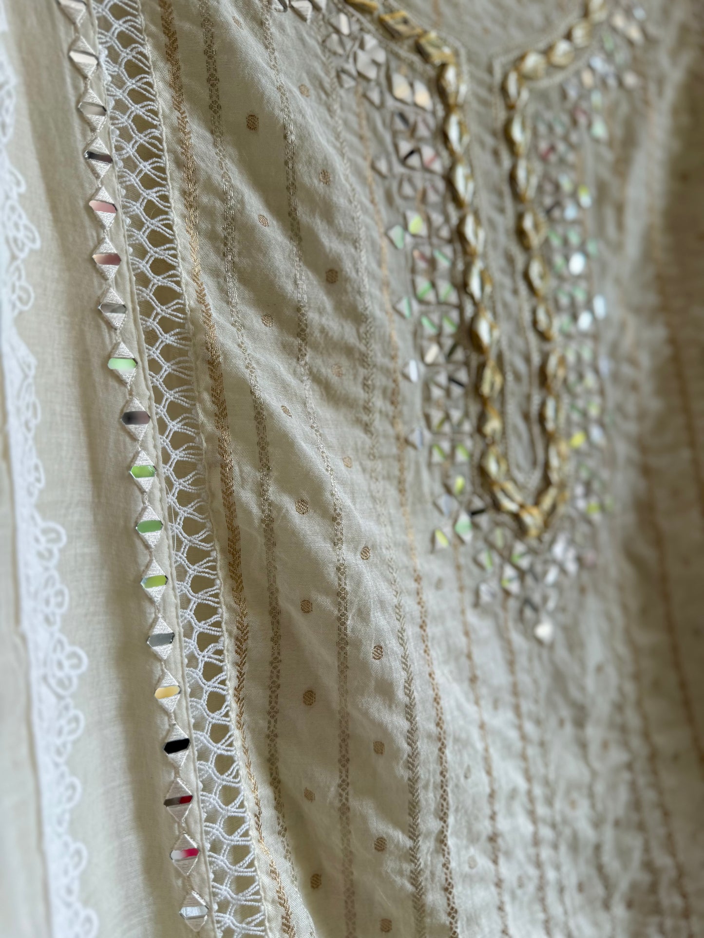 Luxurious Mul chanderi gold appliqué work suit
