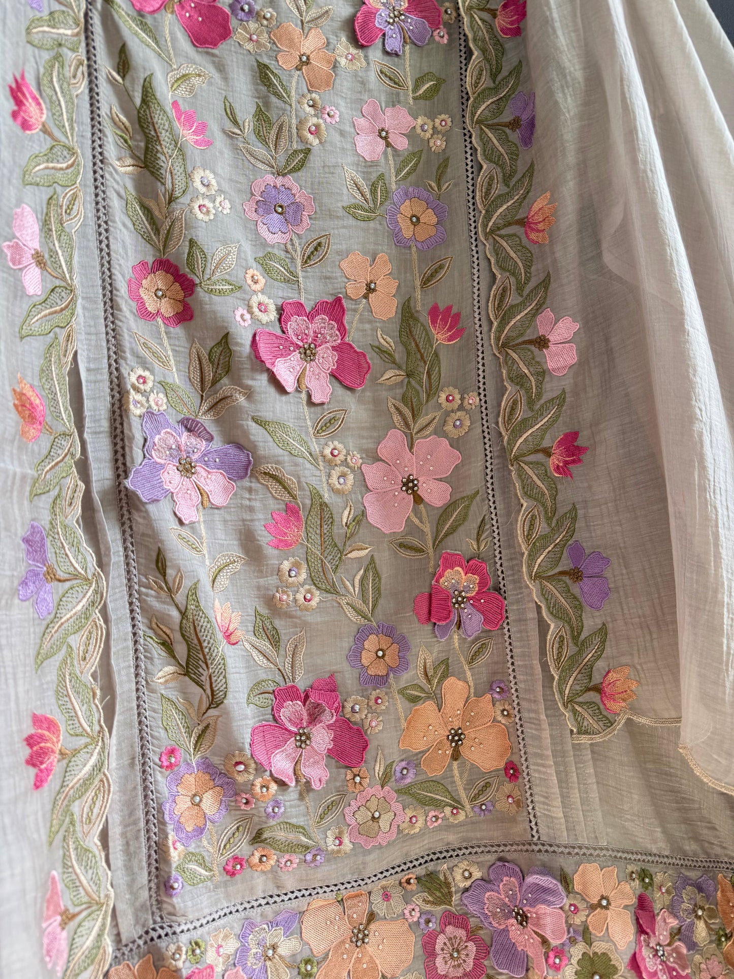 Luxurious Mul chanderi appliqué work floral suit