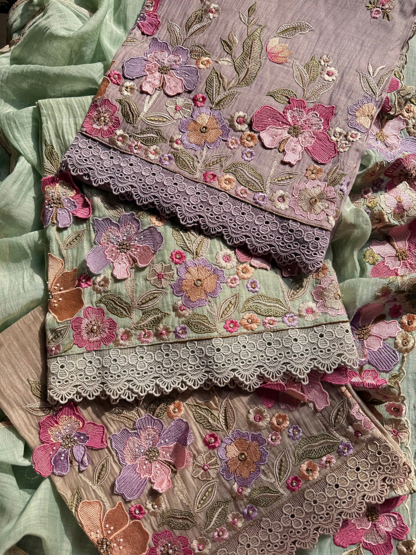 Luxurious Mul chanderi appliqué work floral suit