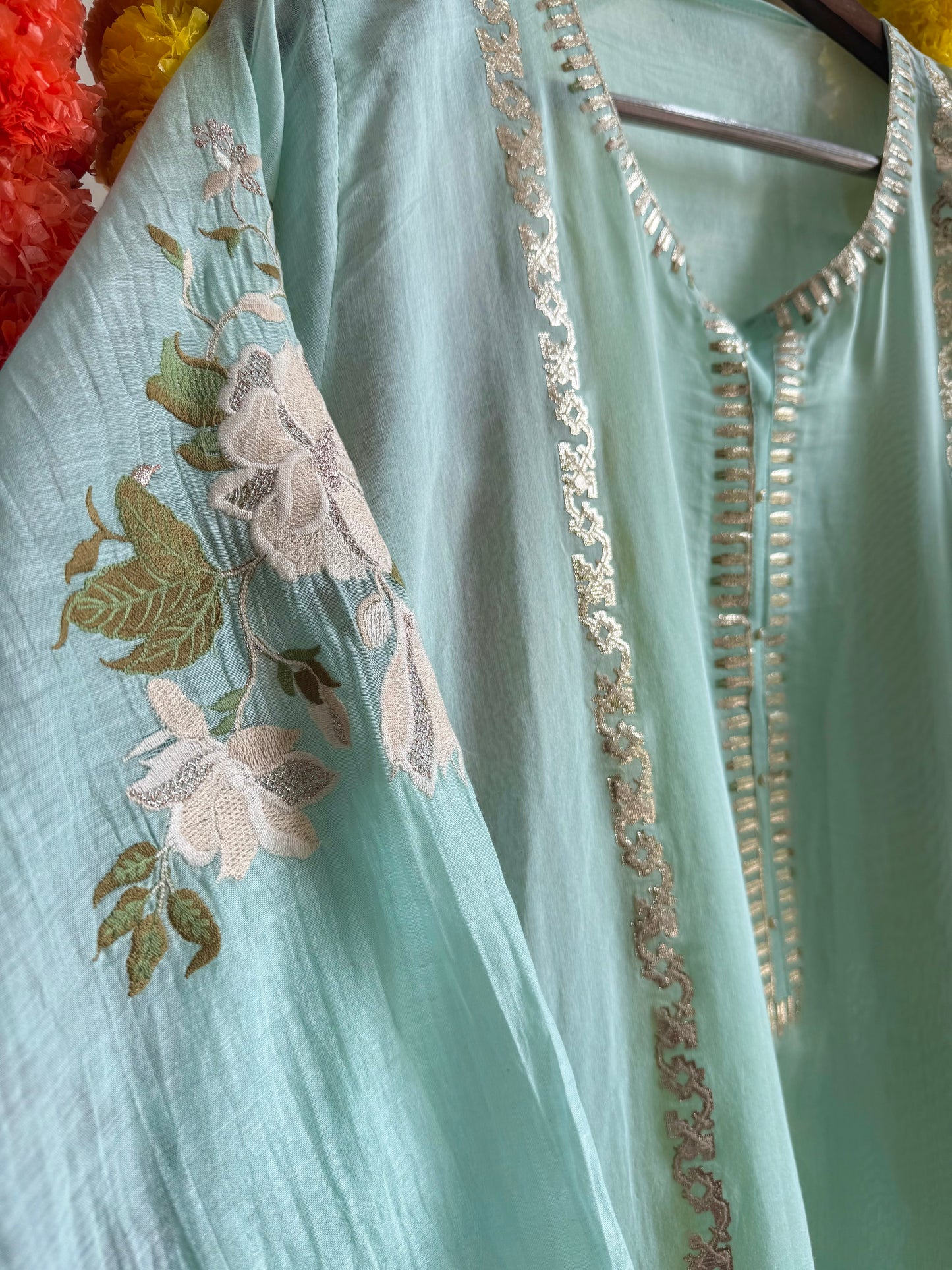 Luxurious Mul chanderi gold appliqué work suit