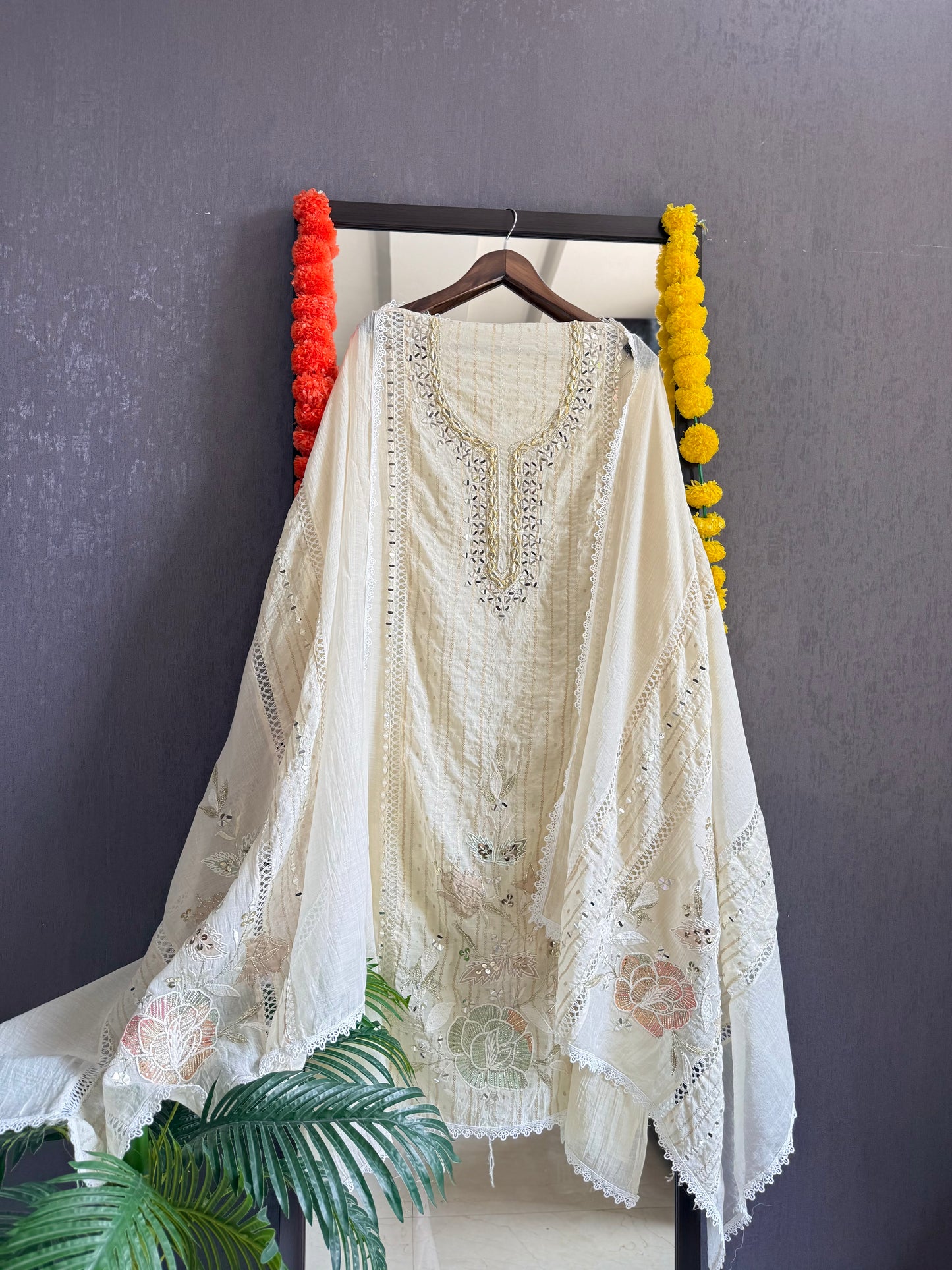 Luxurious Mul chanderi gold appliqué work suit