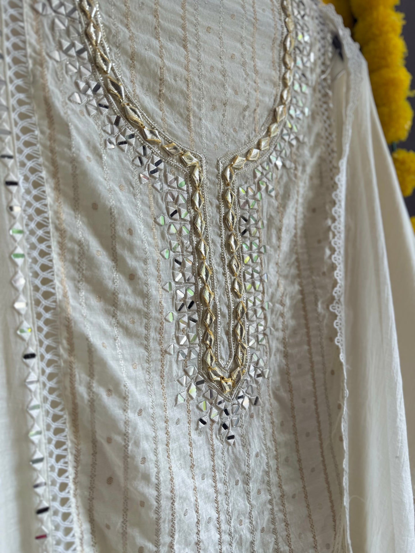 Luxurious Mul chanderi gold appliqué work suit