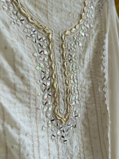 Luxurious Mul chanderi gold appliqué work suit