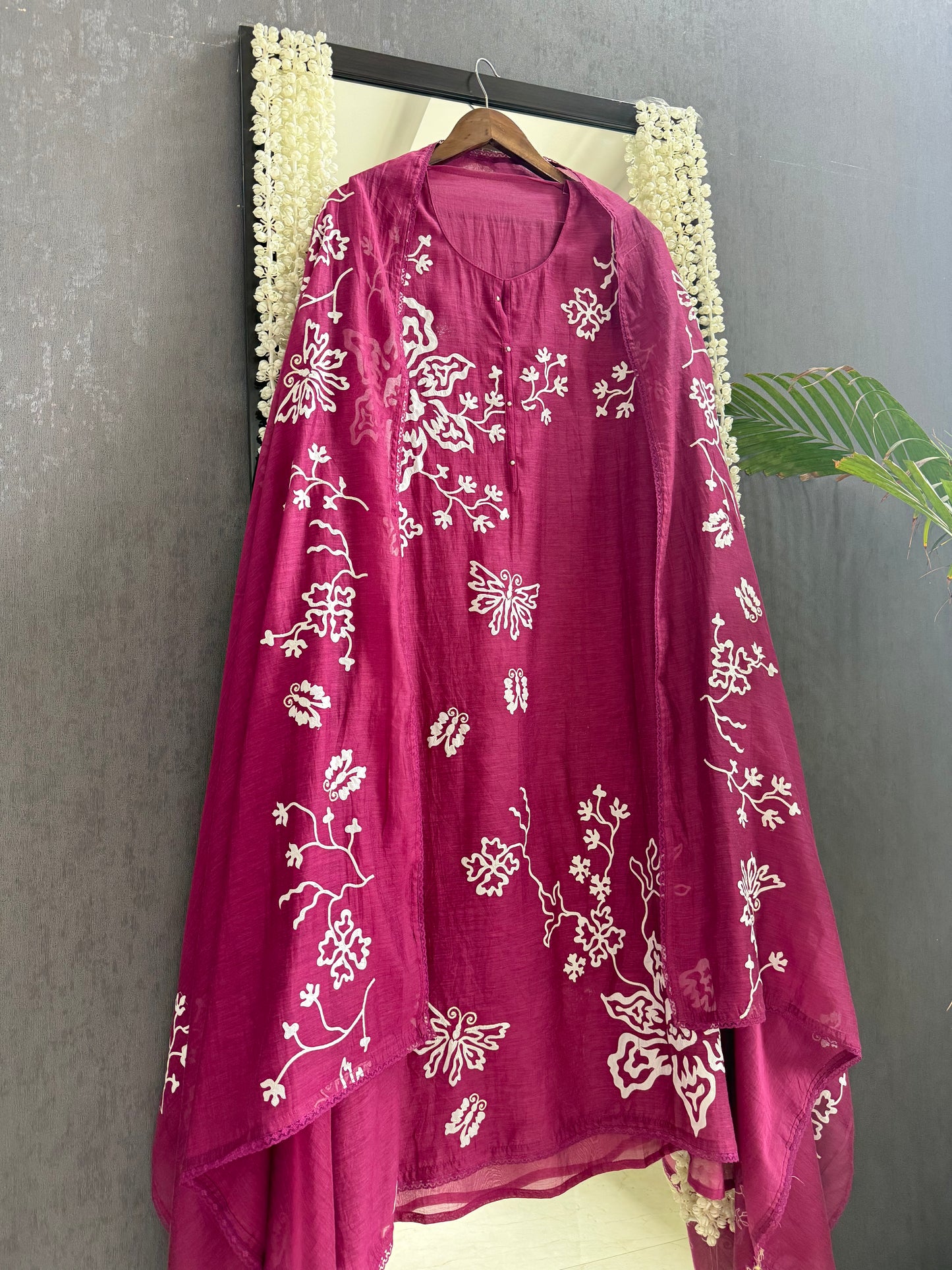 Luxurious Mul chanderi appliqué butterfly suit