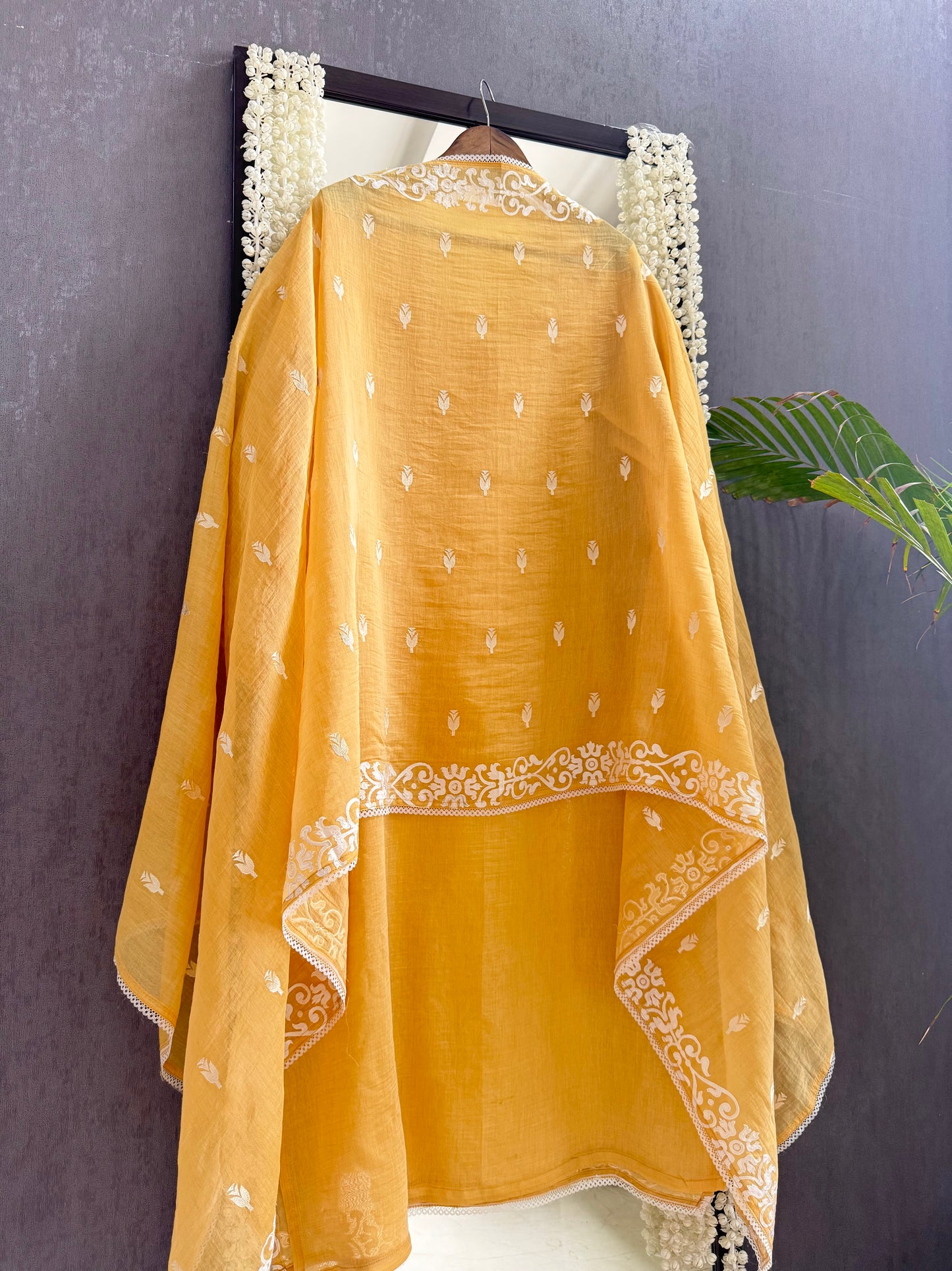 Luxurious Mul chanderi appliqué work suit