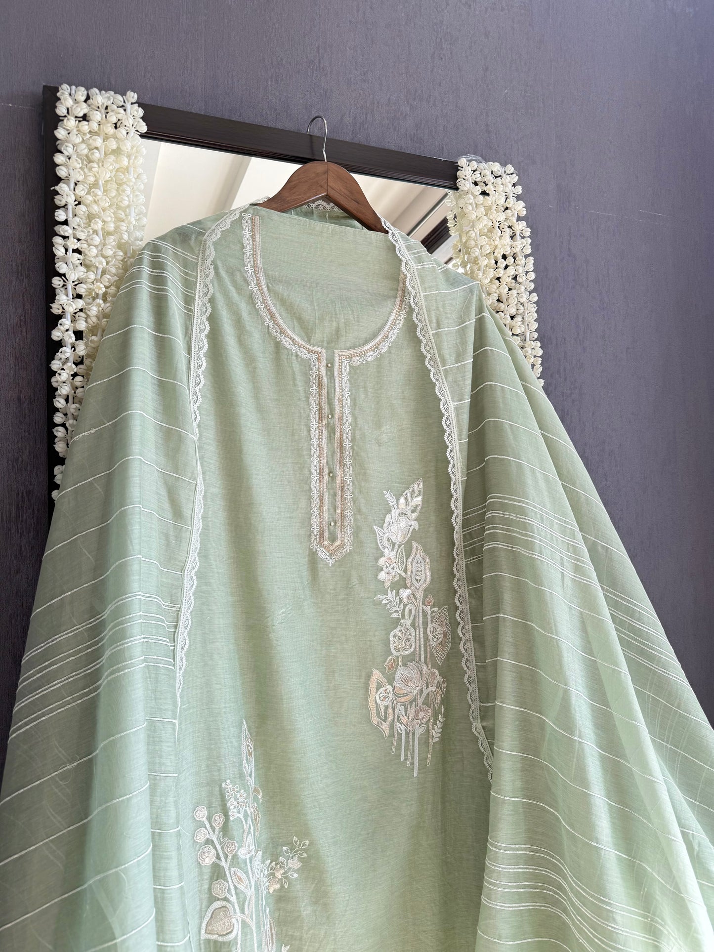 Luxurious Mul chanderi gold appliqué work suit