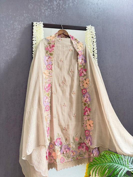 Luxurious Mul chanderi appliqué work floral suit