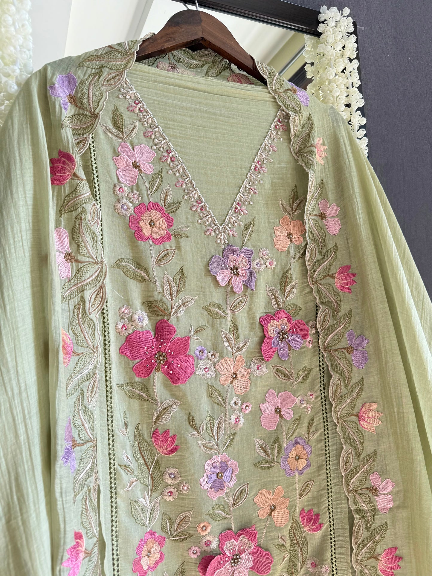 Luxurious Mul chanderi appliqué work floral suit
