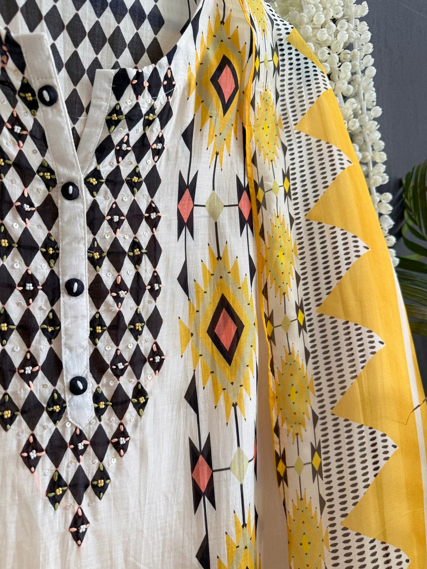 Muslin ikkat inspired handwork suits