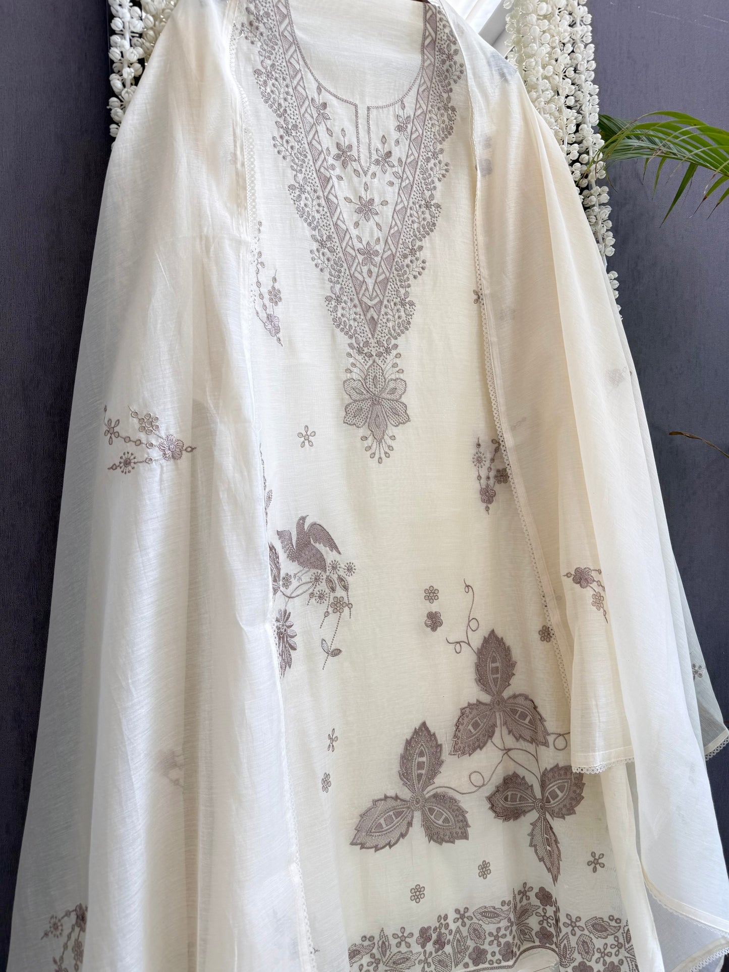 Luxurious Mul chanderi threadwork schiffili suit