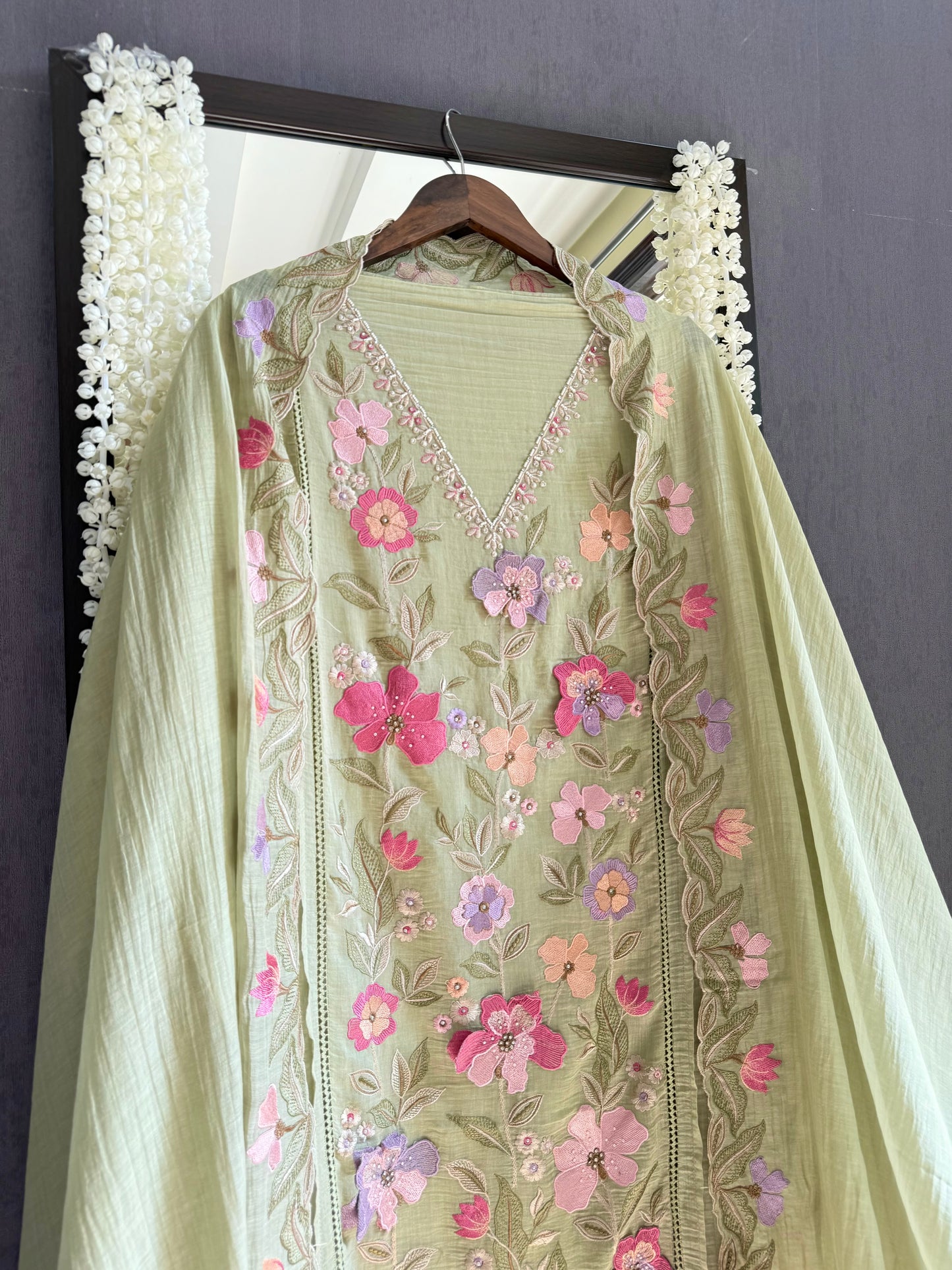 Luxurious Mul chanderi appliqué work floral suit