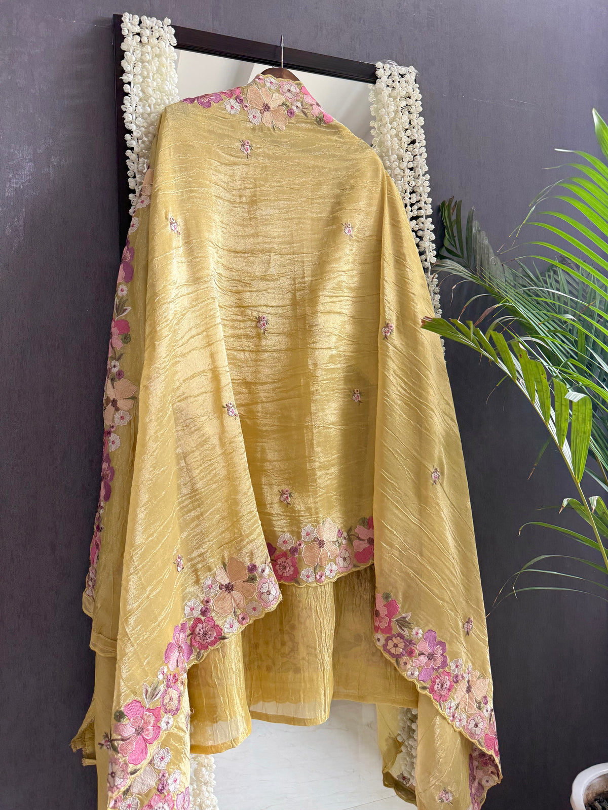 Luxurious Mul chanderi appliqué work floral suit