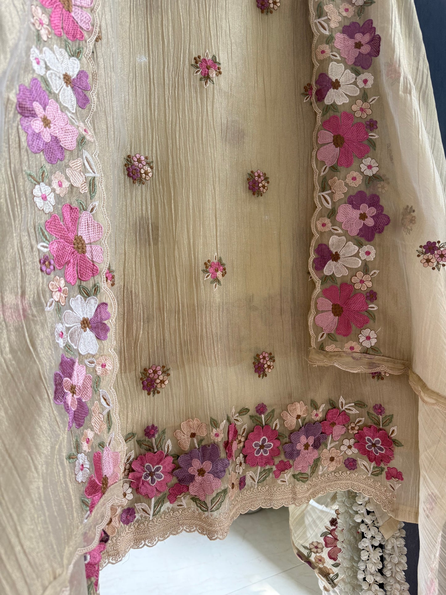 Luxurious Mul chanderi appliqué work floral suit