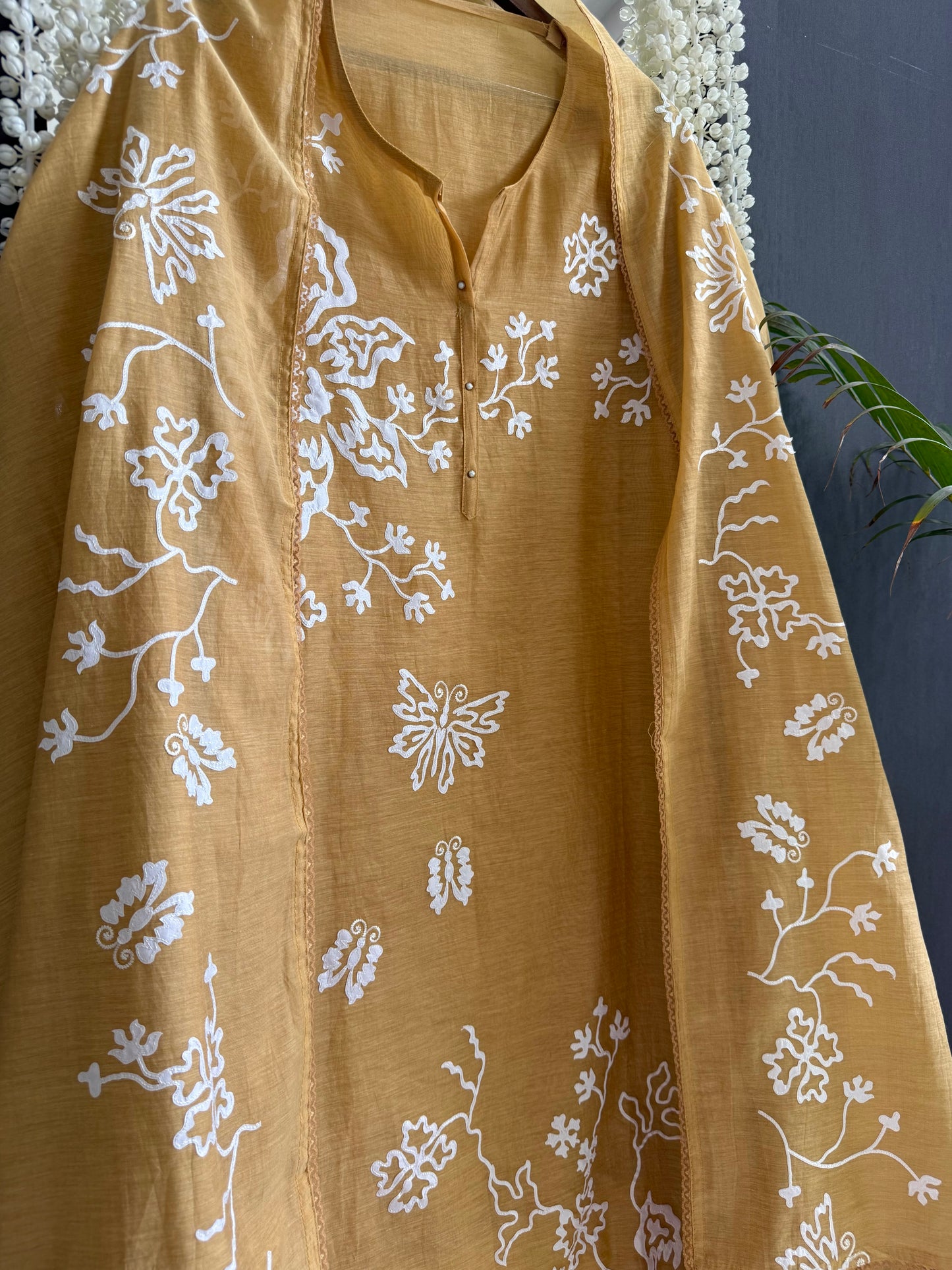 Luxurious Mul chanderi appliqué butterfly suit