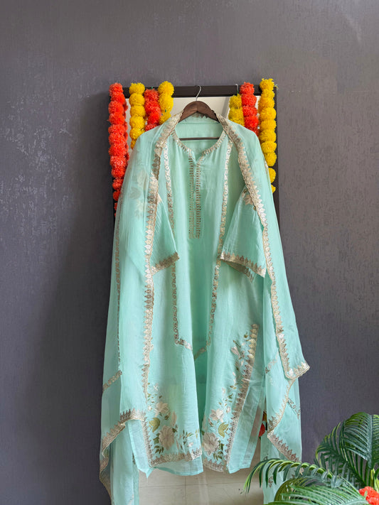 Luxurious Mul chanderi gold appliqué work suit