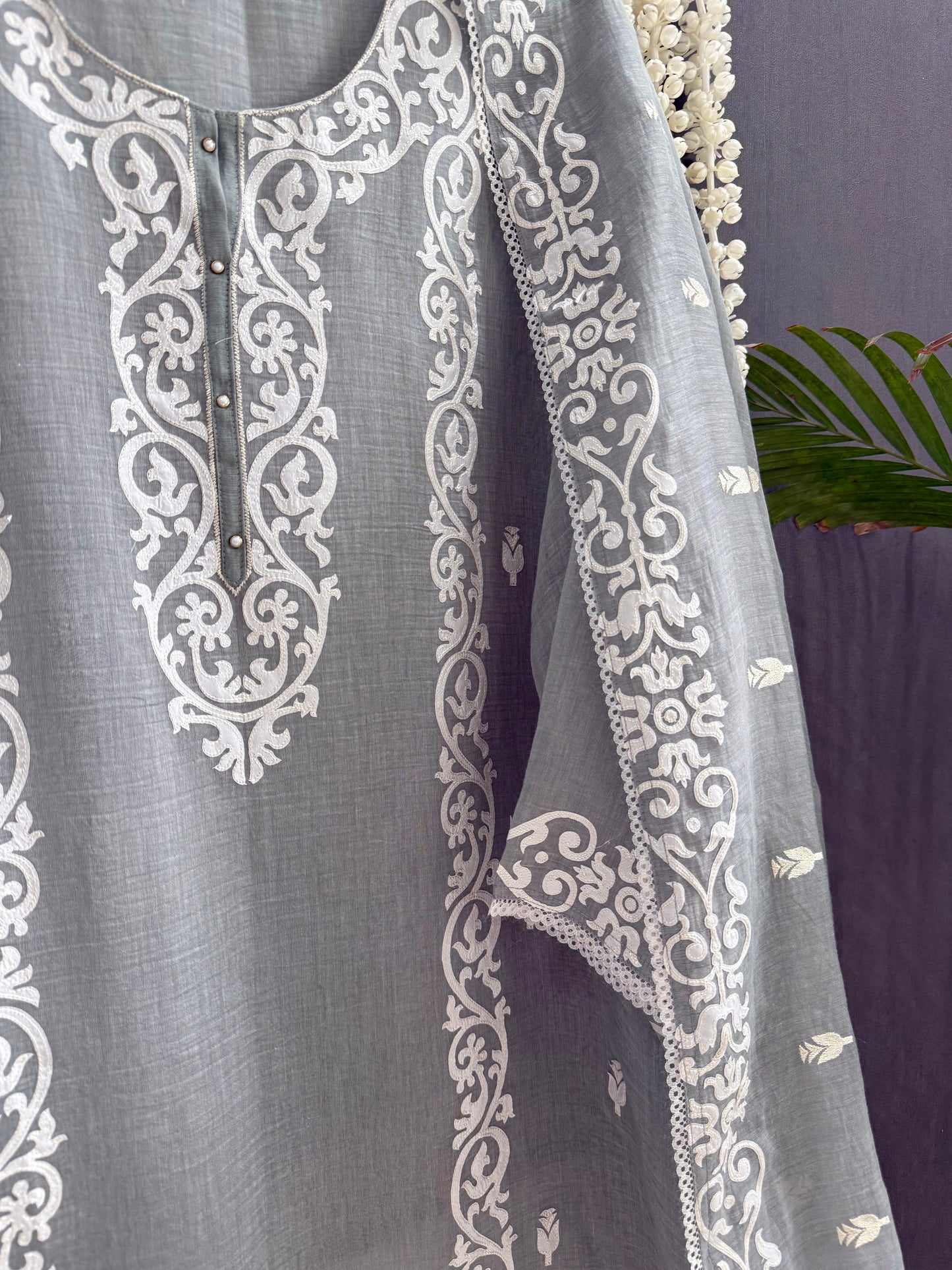 Luxurious Mul chanderi appliqué work suit