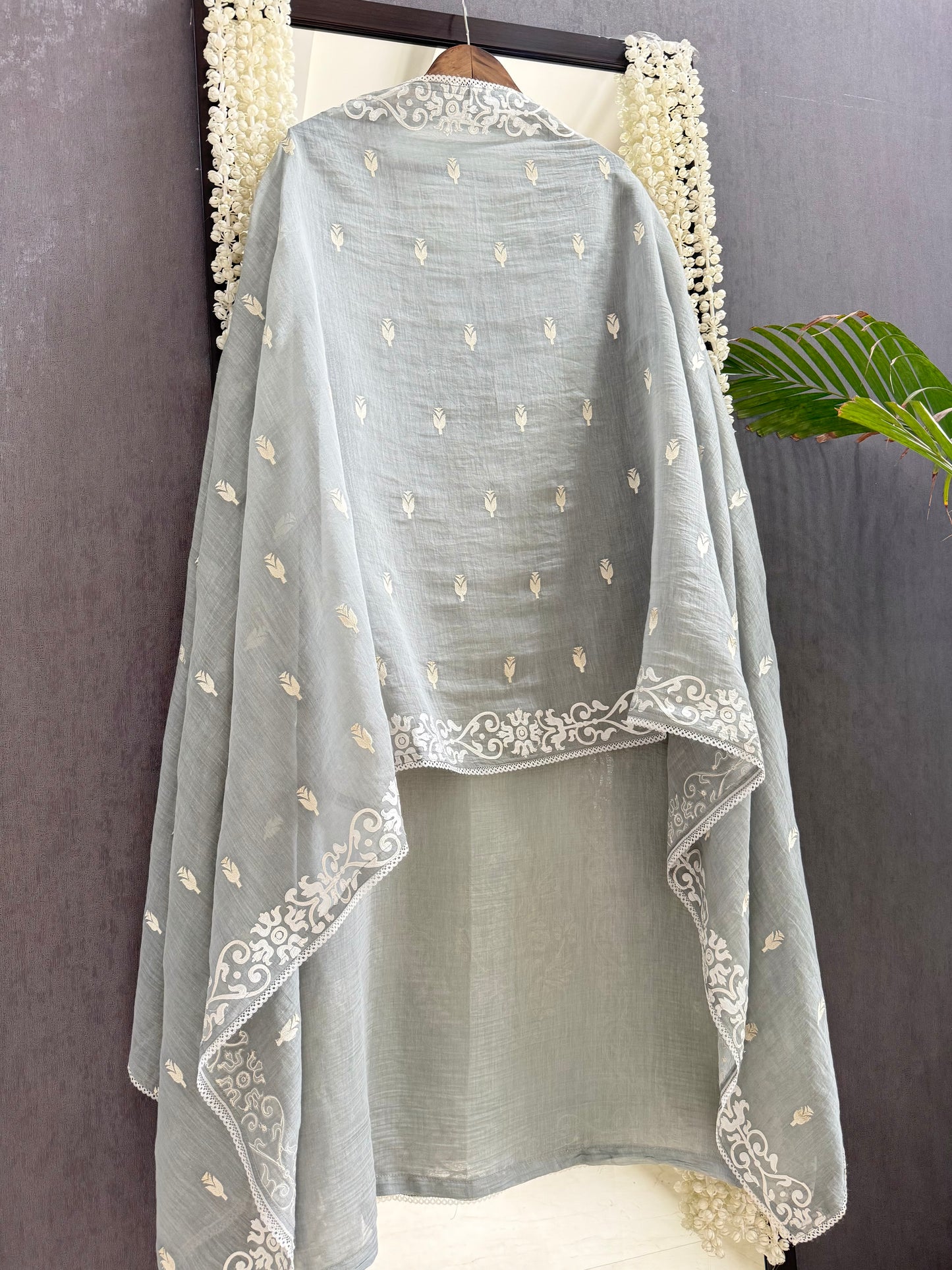Luxurious Mul chanderi appliqué work suit